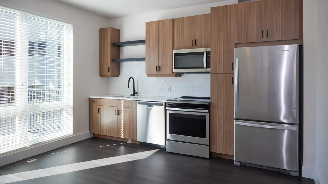 Galley kitchen cabinetry with appliances installed